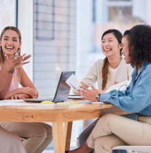 Women Discussing In A Meeting (joyful)